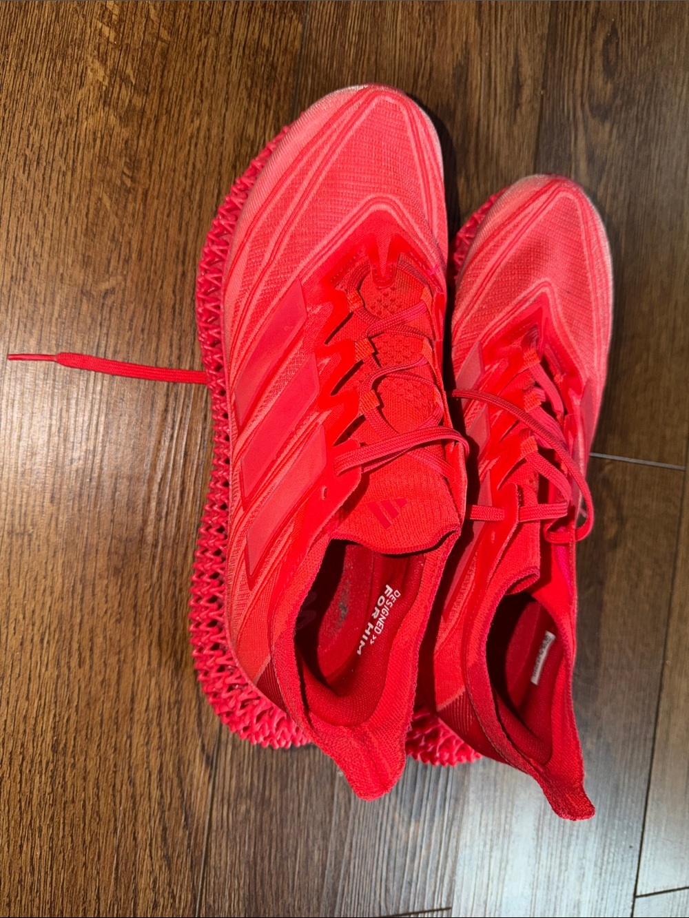 Men’s red 3d printed addidas running sneakers.
